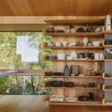 18 Interior Projects that Use Open Storage to Hide Clutter in Plain Sight - Image 6 of 19